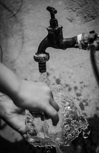 Cropped image of man holding water