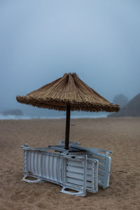 Lifeguard hut on beach against clear sky