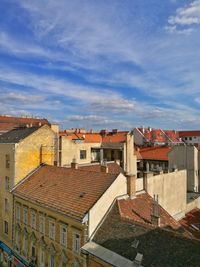 Houses in town against sky