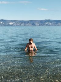 Portrait of shirtless man in swimming pool