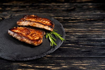 High angle view of meat on barbecue grill