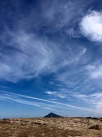 Scenic view of landscape against blue sky