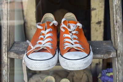 Canvas footwear on ladder