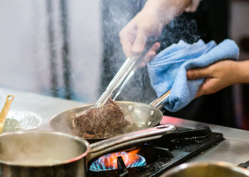 Midsection of man preparing food