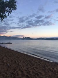 Scenic view of beach against sky during sunset