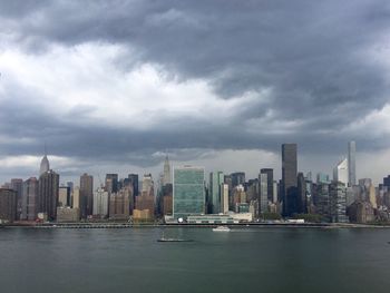 City skyline against cloudy sky