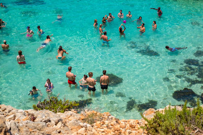 High angle view of people swimming in pool