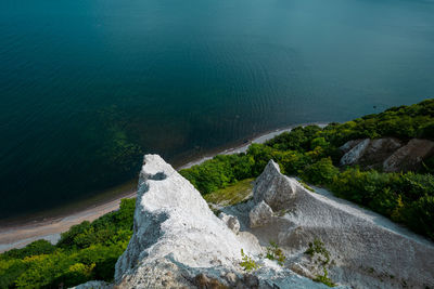 High angle view of rocks by sea