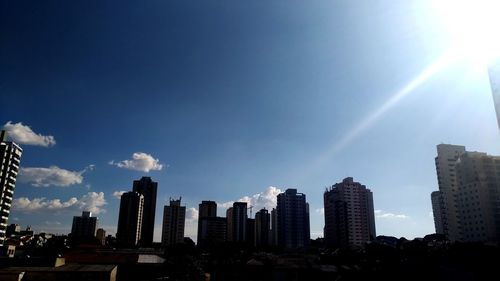 Modern buildings against sky in city