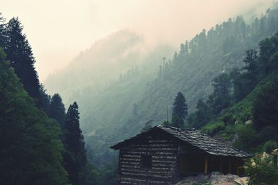 Scenic view of mountains in foggy weather