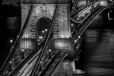 Illuminated bridge at night