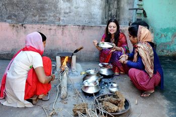 Women preparing food on terrace