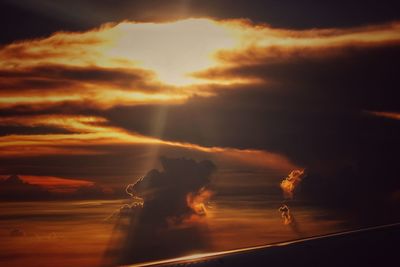 Low angle view of dramatic sky during sunset