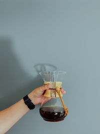 Cropped hand of woman holding wineglass