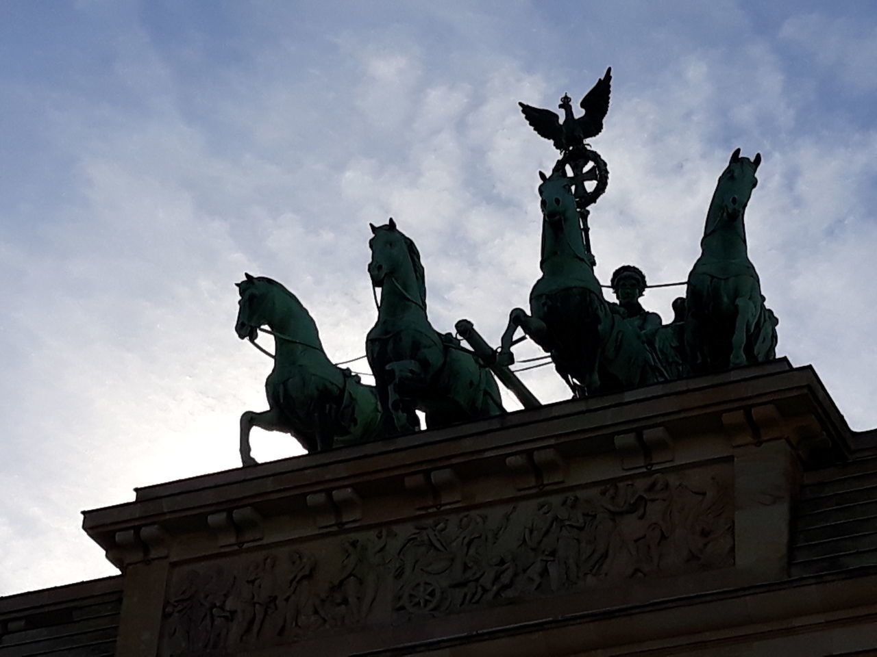 LOW ANGLE VIEW OF STATUES AGAINST SKY