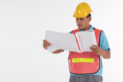 Man working against white background