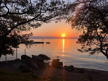 Scenic view of sea against orange sky