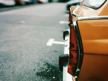 Close-up of a car on road