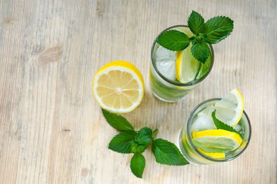 Lemons slices in drink on table