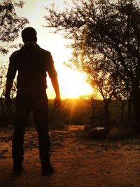 Silhouette of people at sunset