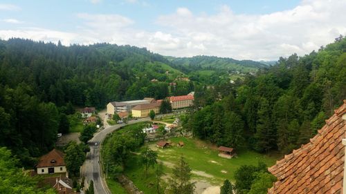 High angle view of trees and buildings against sky