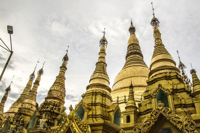 Low angle view of pagoda against buildings