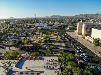 High angle view of buildings in city against clear sky