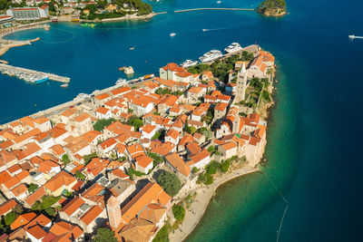 High angle view of buildings by sea