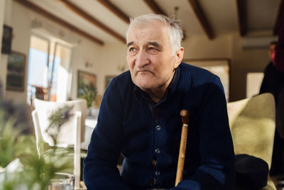 Portrait of man sitting at home