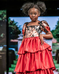 Full length of girl standing on red outdoors