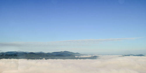 Scenic view of mountains against clear blue sky