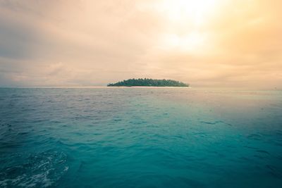 Scenic view of fiji island against sky at sunset