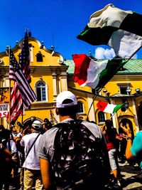 Low angle view of people against clear sky