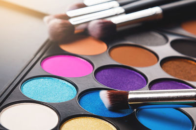 Close-up of make-up on table