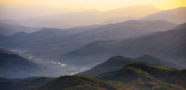 Scenic view of mountains against sky during sunset