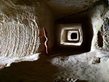 Man and woman standing in tunnel