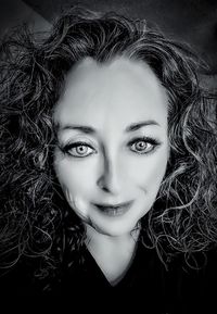 Close-up portrait of young woman with eyes closed