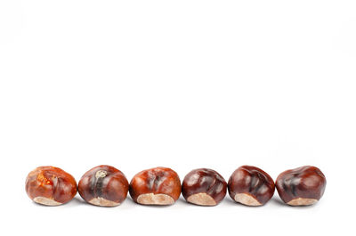 Close-up of fruits against white background