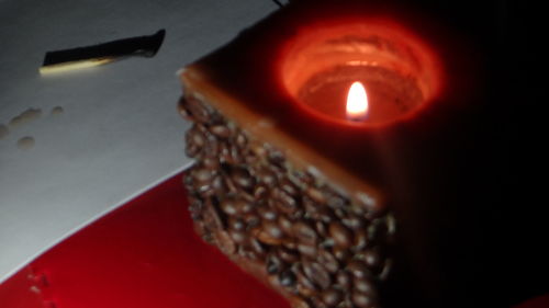 Close-up of lit candles on birthday cake