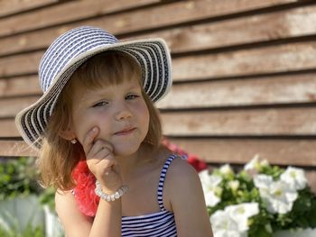 Portrait of cute girl wearing hat