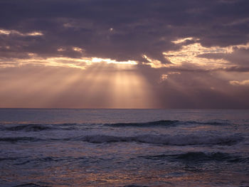 Scenic view of sea against sky at sunset