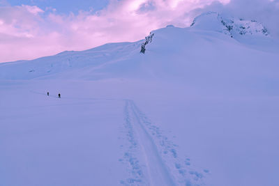 Scenic view of mountains against sky during winter