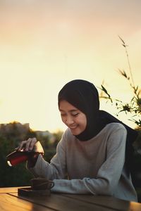 Young woman using mobile phone