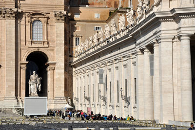 Statue in front of historical building