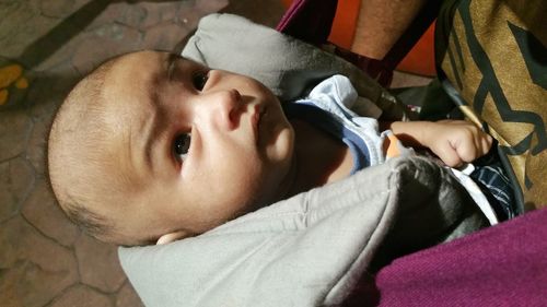 High angle view of baby sleeping at home