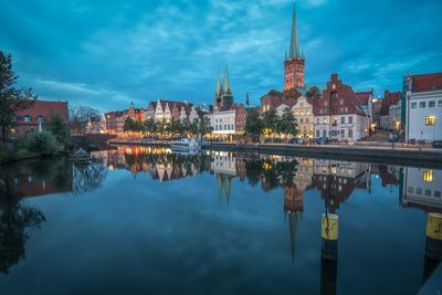 Reflection of illuminated buildings in water