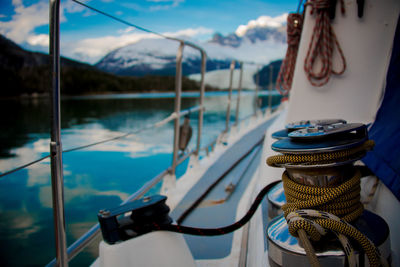 Boats moored in sea against sky