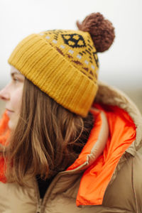 Close-up portrait of woman wearing hat