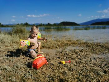 Boy with toy on beach