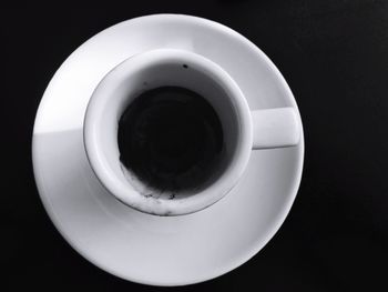 Close-up of cup over black background
